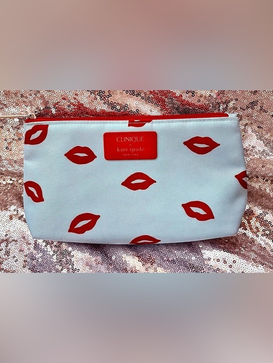 kate spade Handbags - NWT Kate Spade Lip Print Cosmetic Pouch in White & Red